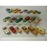 Eighteen unboxed Dinky Toy cars and commercial vehicles dating from the 1950s,