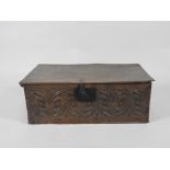 A late 17th century boarded oak bible box the hinged lid over a central iron lock plate and