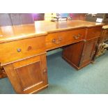 A late Victorian mahogany pedestal sideboard