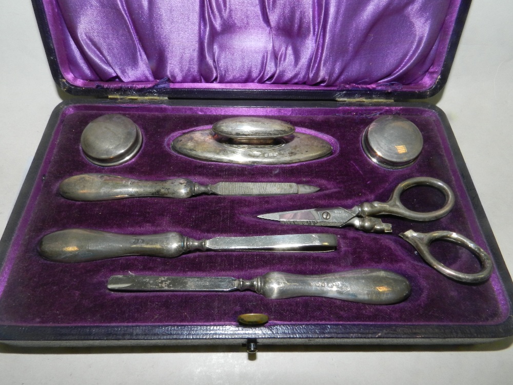 A cased silver mounted manicure set