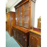 A Victorian mahogany glazed cabinet sideboard with cavetto cornice above three glazed doors the