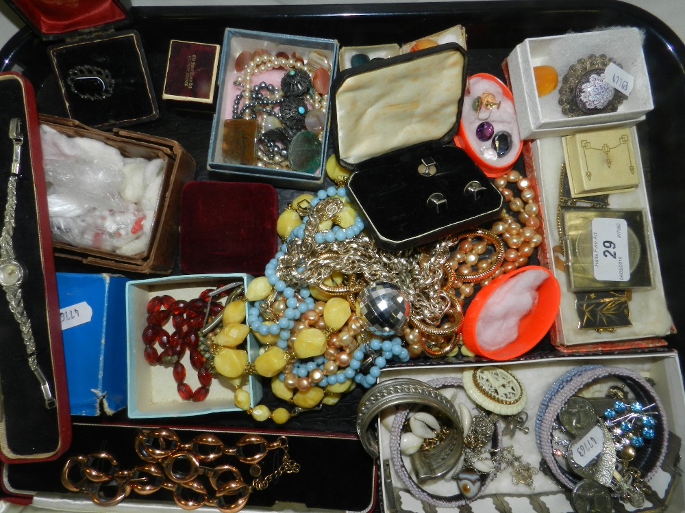 A collection of various pieces of costume jewellery to include bead necklaces, loose stones,