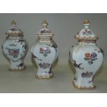 A garniture of three Samson Chinese export style baluster vases and covers