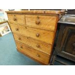 A late 19th century satinwood chest of two short over three long drawers having turned handles and