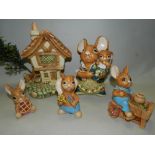 A collection of Pendelfin rabbit figures including four large size figures,