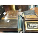 A coromandel writing slope, a brass bound rosewood writing slope, a mahogany tea caddy,