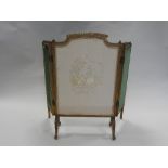 A Louis XVI style giltwood triptych fire screen with leaf moulded and gadrooned show frame,