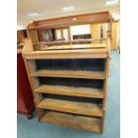 An Edwardian oak open bookcase and another similar