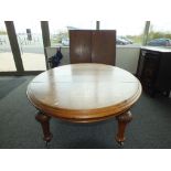 A late Victorian oak wind out dining table