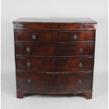 An early 19th century mahogany bow front chest of two short over three long graduated cockbeaded