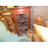 An Edwardian mahogany glazed mural corner cupboard together with a 19th century oak corner cabinet,