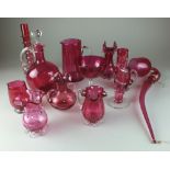 An assorted collection of Victorian cranberry glass, comprising a decanter and stopper, 26cm high,