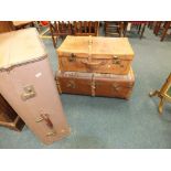A wood bound travel trunk, a leather suitcase,
