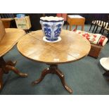 A 19th century oak tripod tilt top occasional table together with a flow blue jardiniere
