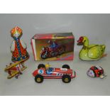 Assorted children's toys including tinplate police cars, race cars,