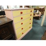 An Edwardian painted pine chest of two short over four long drawers