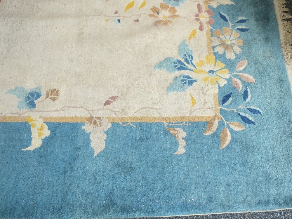 A 20th century Chinese blue and cream ground carpet