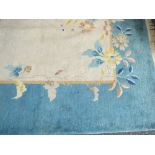 A 20th century Chinese blue and cream ground carpet