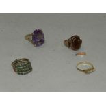 An amethyst set dress ring together with a seed pearl set ring lacking one pearl,