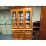 A reproduction walnut glazed cabinet,