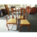 A set of eight reproduction mahogany dining chairs having drop-in seat cushions and comprising six