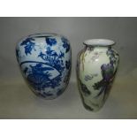 A Watcombe Torquay ware charger, a blue and white crackle glaze vase,