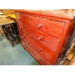 An Edwardian stained pine chest of two short over three long drawers raised on bun feet