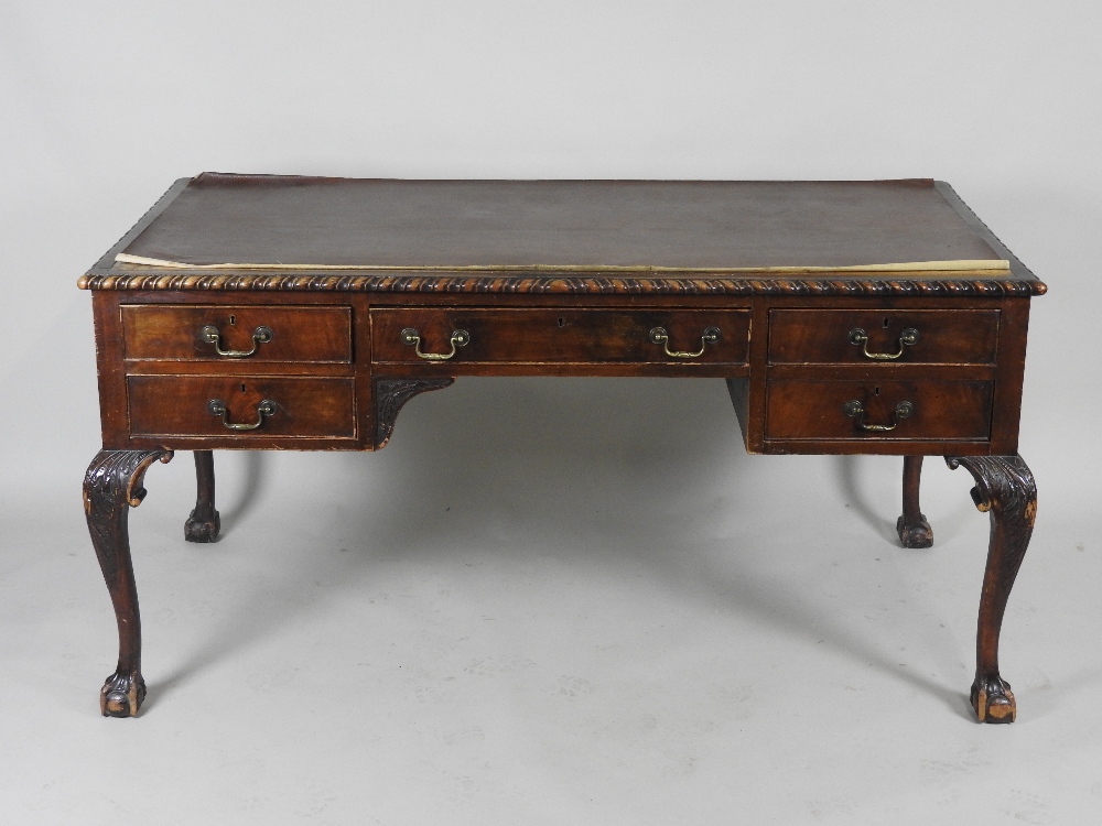An early 20th century mahogany writing table,
