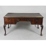 An early 20th century mahogany writing table,