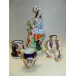 A small quantity of copper lustre jugs, a Staffordshire figure of man and hounds,