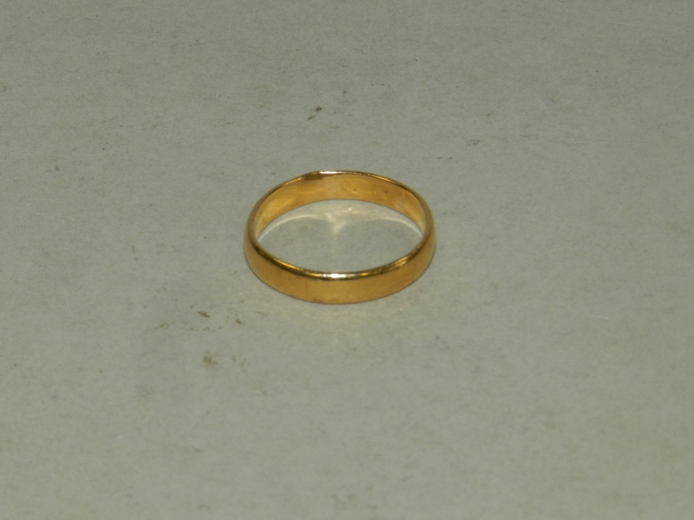 A 22ct gold plain polished wedding band