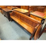A 19th century oak bench or low pew