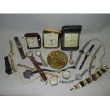 A yellow metal wristwatch with expandable strap together various other wristwatches,