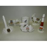 A collection of W H Goss crested wares including animals, a preserve jar base,
