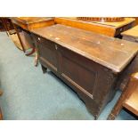 An early 18th century oak panelled coffer