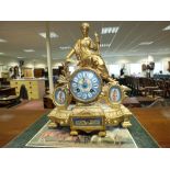 A French gilt metal mantel clock inset with Sevres porcelain panels and dial,