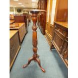 A late Victorian mahogany tripod plant stand