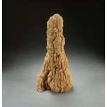 A large aragonite scholar's rock, the orange-hued stone of botryoidal form and vertical orientation,