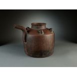 A Chinese Yixing teapot, late Ming/early Qing Dynasty, of barrel form with hexagonal section spout,