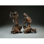 A pair of Chinese carved rootwood figures of shen, 18th/19th Century,