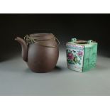 A Chinese Yixing teapot, 20th Century, of ovoid form with double wire handle, 15cm high,