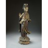 A Chinese carved, painted and parcel gilt wood figure of Guanyin, late Qing Dynasty,