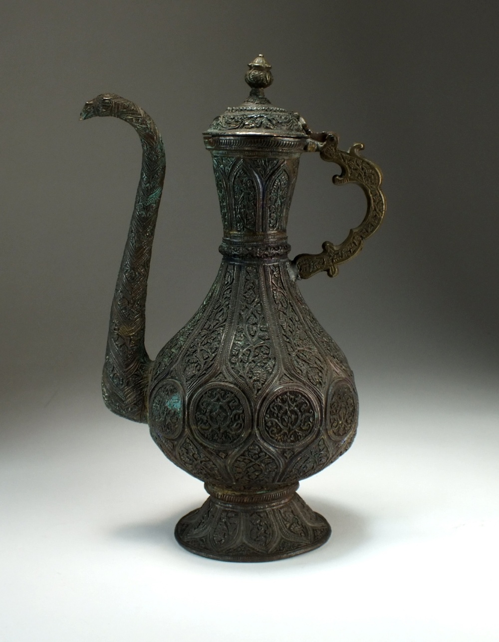 An Islamic bronze repousse ewer, 19th Century,