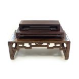 A Chinese hardwood low table, 20th Century, of rectangular outline with rounded ends,