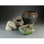 An assembled group of four early Chinese ceramics, a Neolithic vessel of buff earthenware,