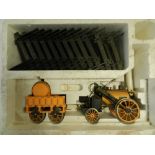 A part boxed Hornby live Loco "The Rocket" little evidence of use and with track in lower box,