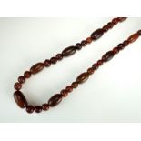 A buffalo horn graduated bead necklace,