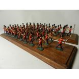 Two 28 member 55mm figure military bands mounted on display plinths,