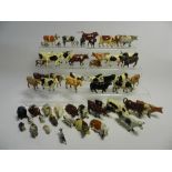 A collection of cattle all cast in lead and by various makers in a variety of poses,