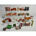 A collection of die cast accessories by Dinky and other makers to include hay rakes, harrows,